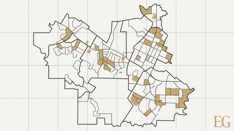 A light-colored map with black outlines showing school boundaries affecting home values, with some areas highlighted in tan.