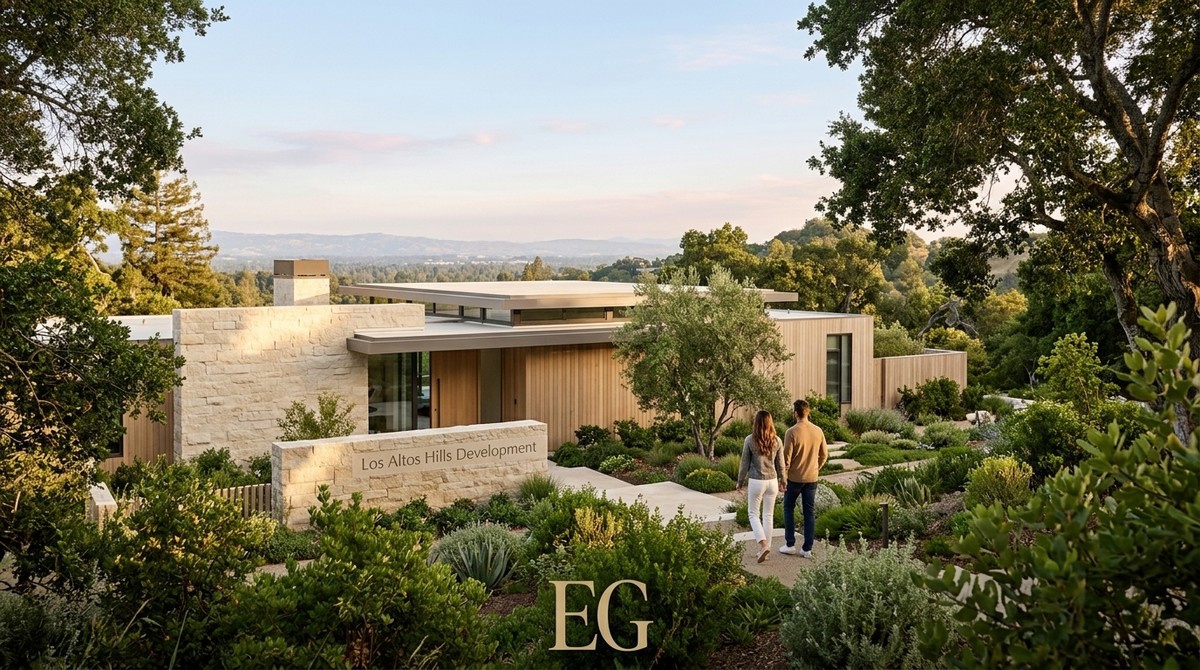 A couple walks toward a modern home with stone and wood siding, surrounded by lush Los Altos Hills development landscaping.